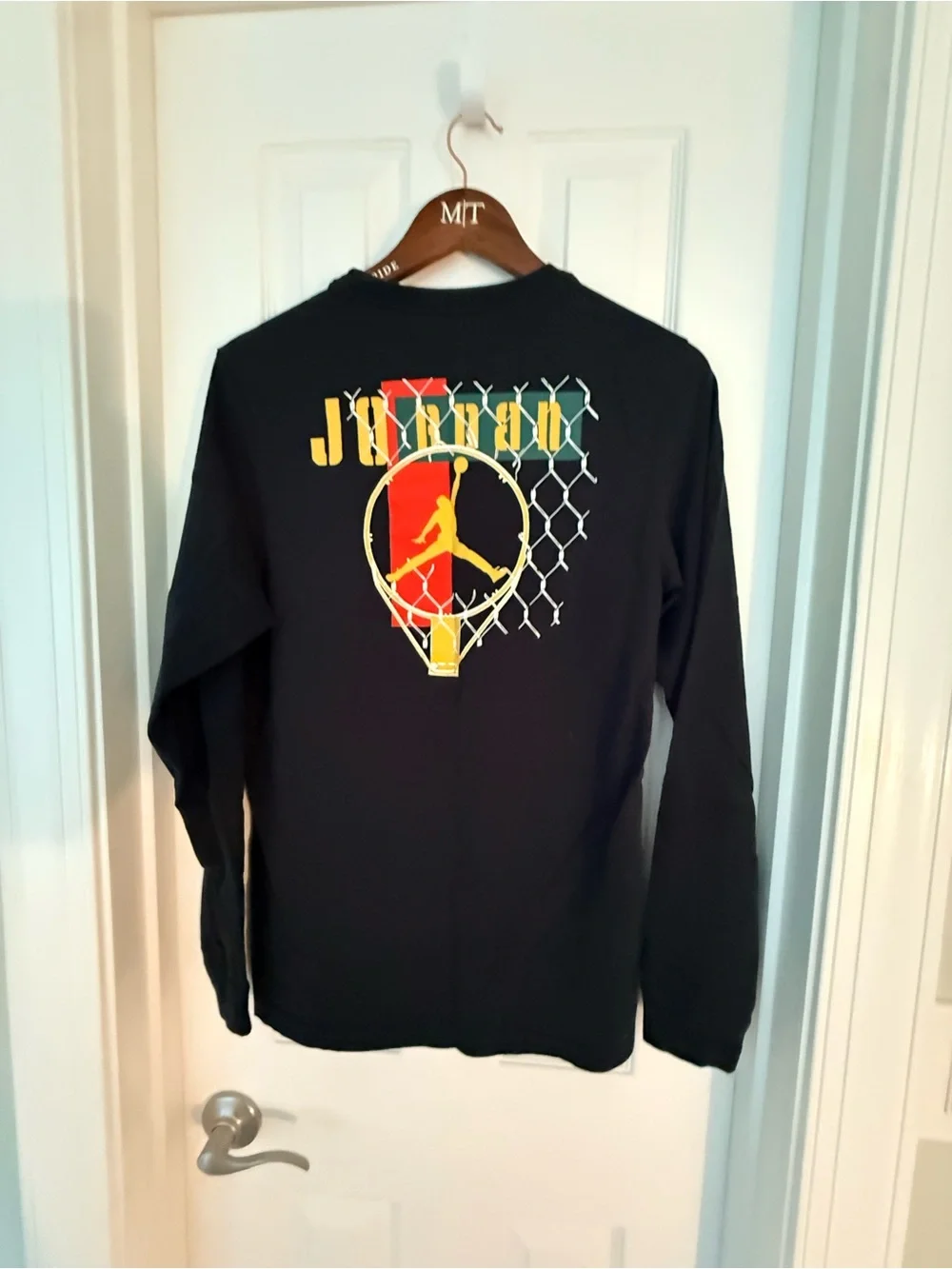 Jordan Black Long Sleeve Tee with White Logo and Orange Basketball Accent